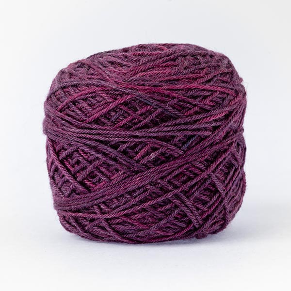 wool blend purple colour ball of yarn